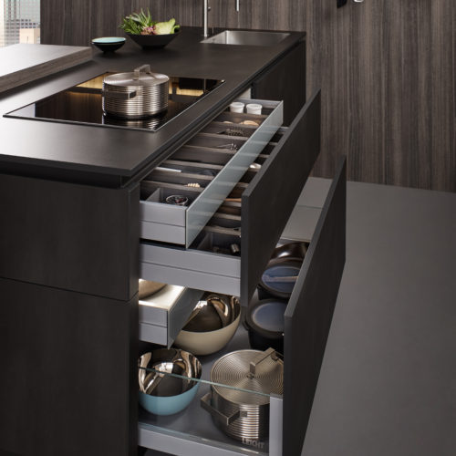 alt="Side view of island showing open drawers and pull outs with Q-Box interior systems"
