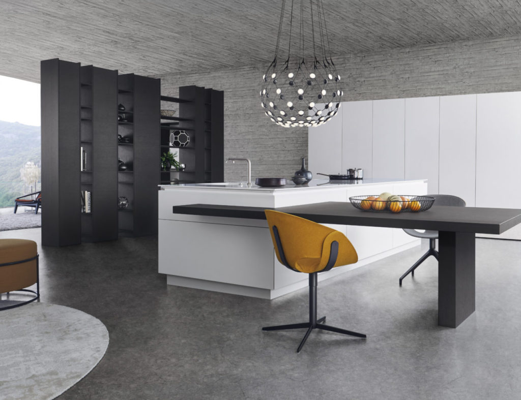 alt="Full kitchen view of island with CLASSIC-FS matte-lacquer white merino surface with TOPOS oak veneered table extension"