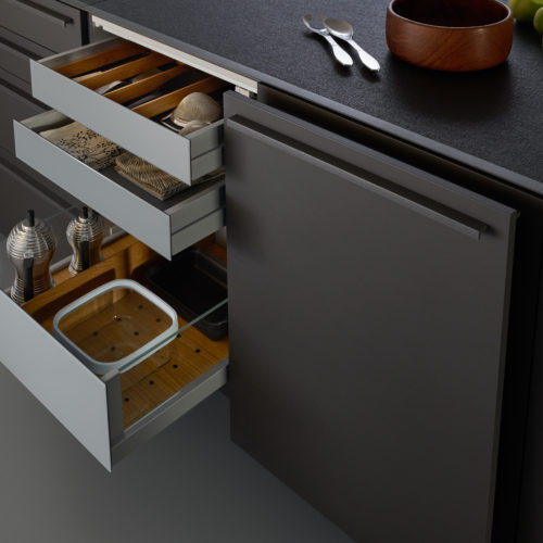 alt="Close up of lower island cabinets with pull outs featuring Q-Box interior organizers"