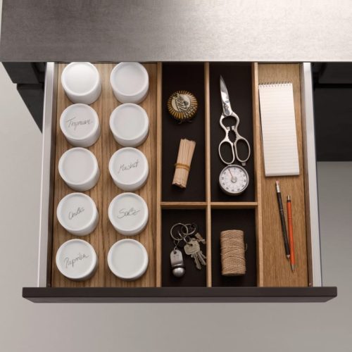 alt="Oak Q-Box system with space for small spice jars, utensils, and pens or pencils"