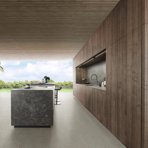 alt="right side view of full kitchen in Walnut BOSSA and island in NASCA"